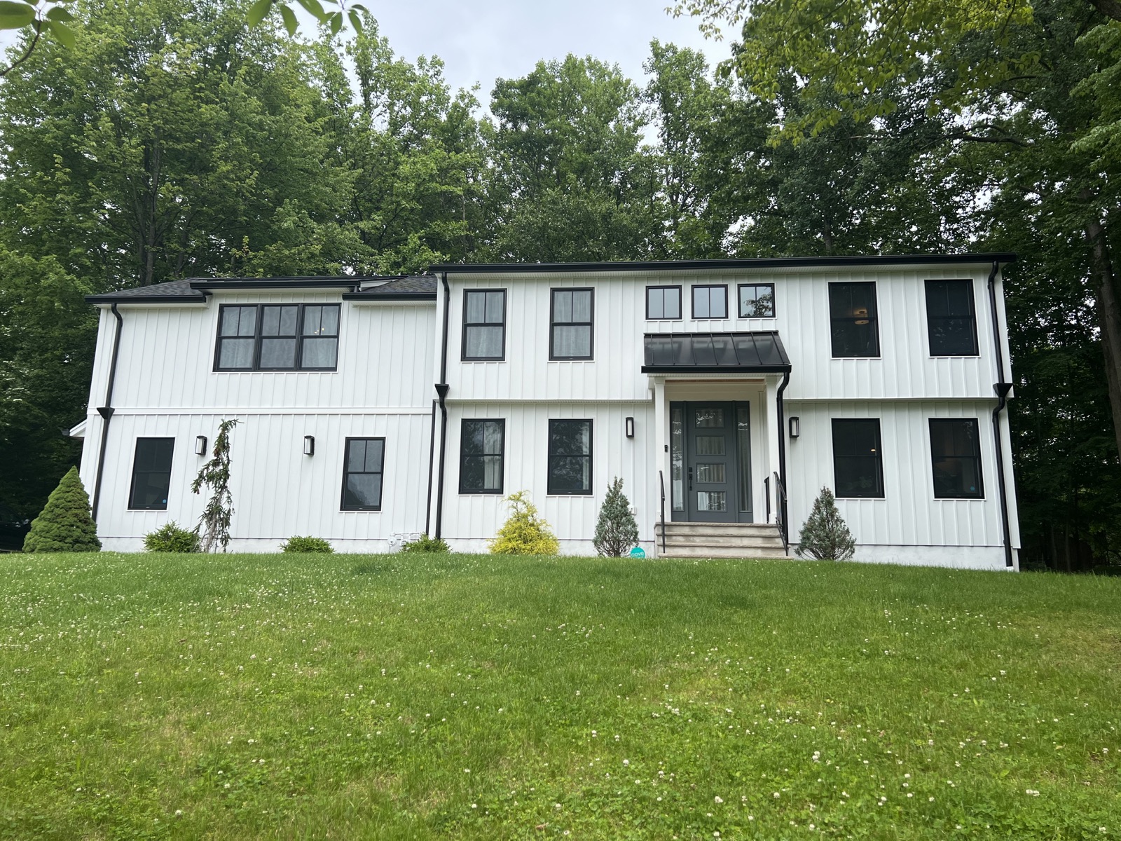 Modern white residence photographed from the front exterior