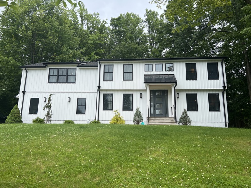 Modern white residence photographed from the front exterior